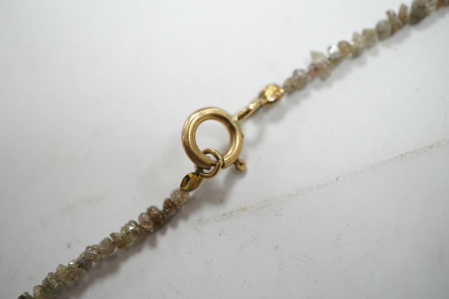 A single strand rough cut diamond necklace, with 750 yellow metal clasp, 40cm. Condition - fair